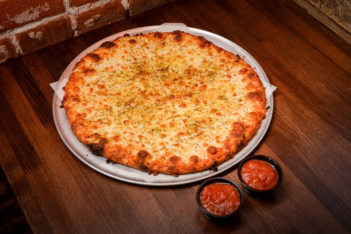 A large pizza sitting on top of a pan.