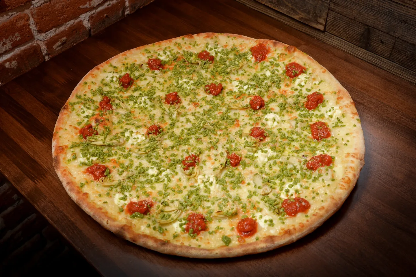 A pizza sitting on top of a wooden table.